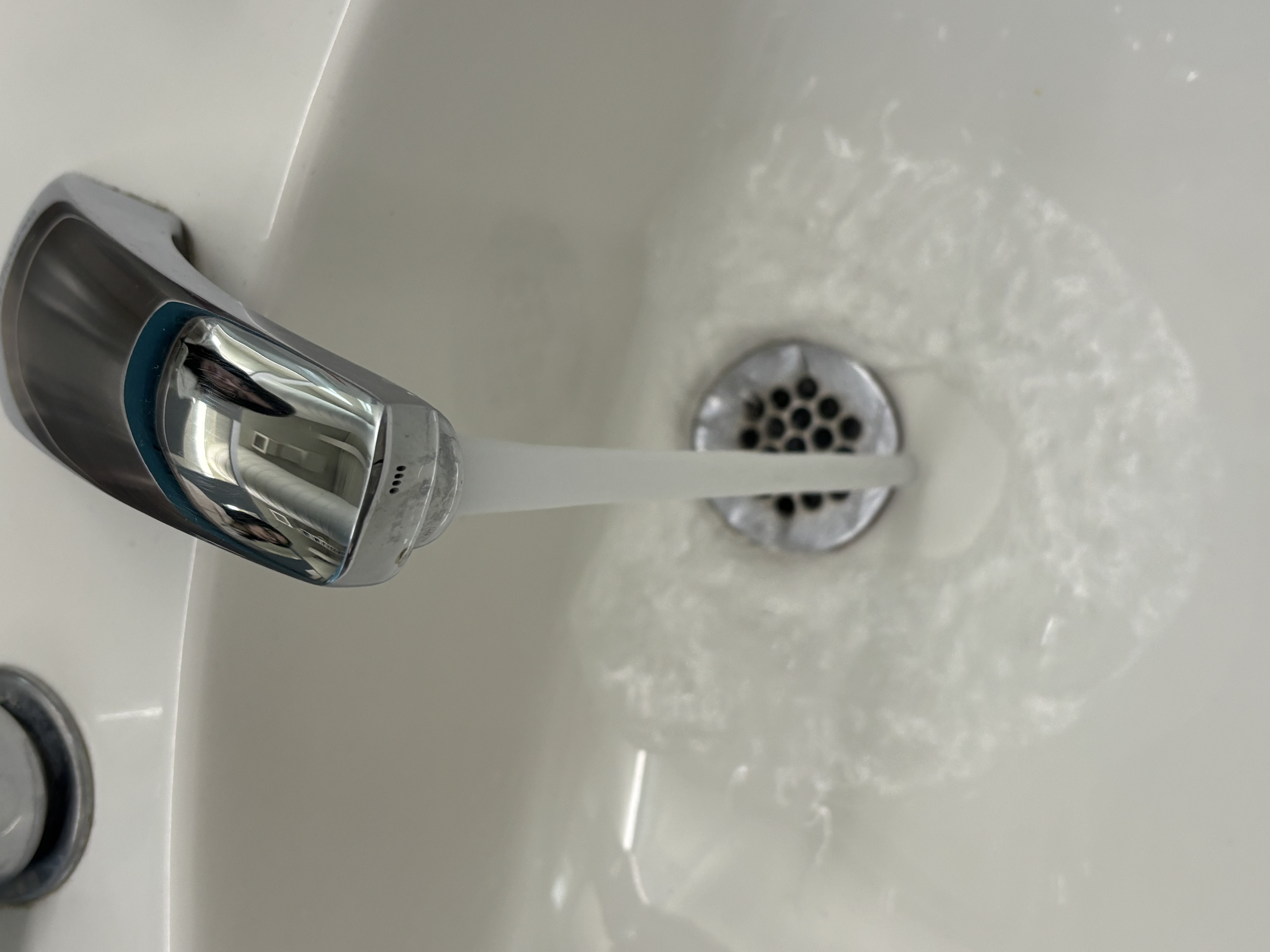 Water faucet that makes a splashing sound when the water is running.