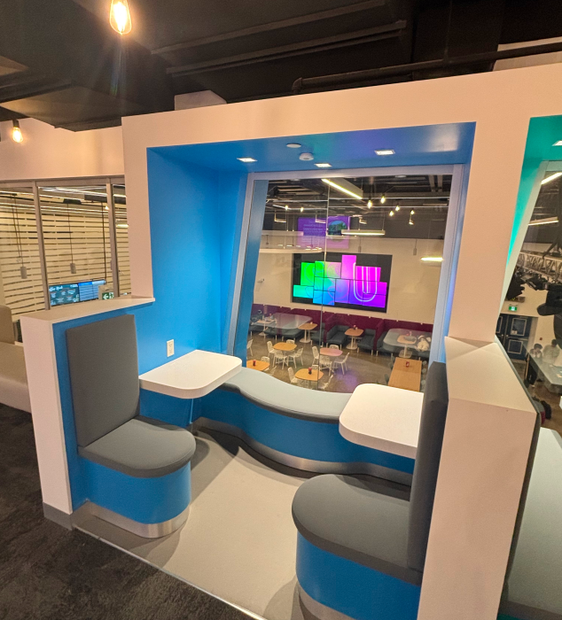 The scene depicted in the photo is a semi-enclosed study area by the window on the second floor of the SSU building at Sheridan College.