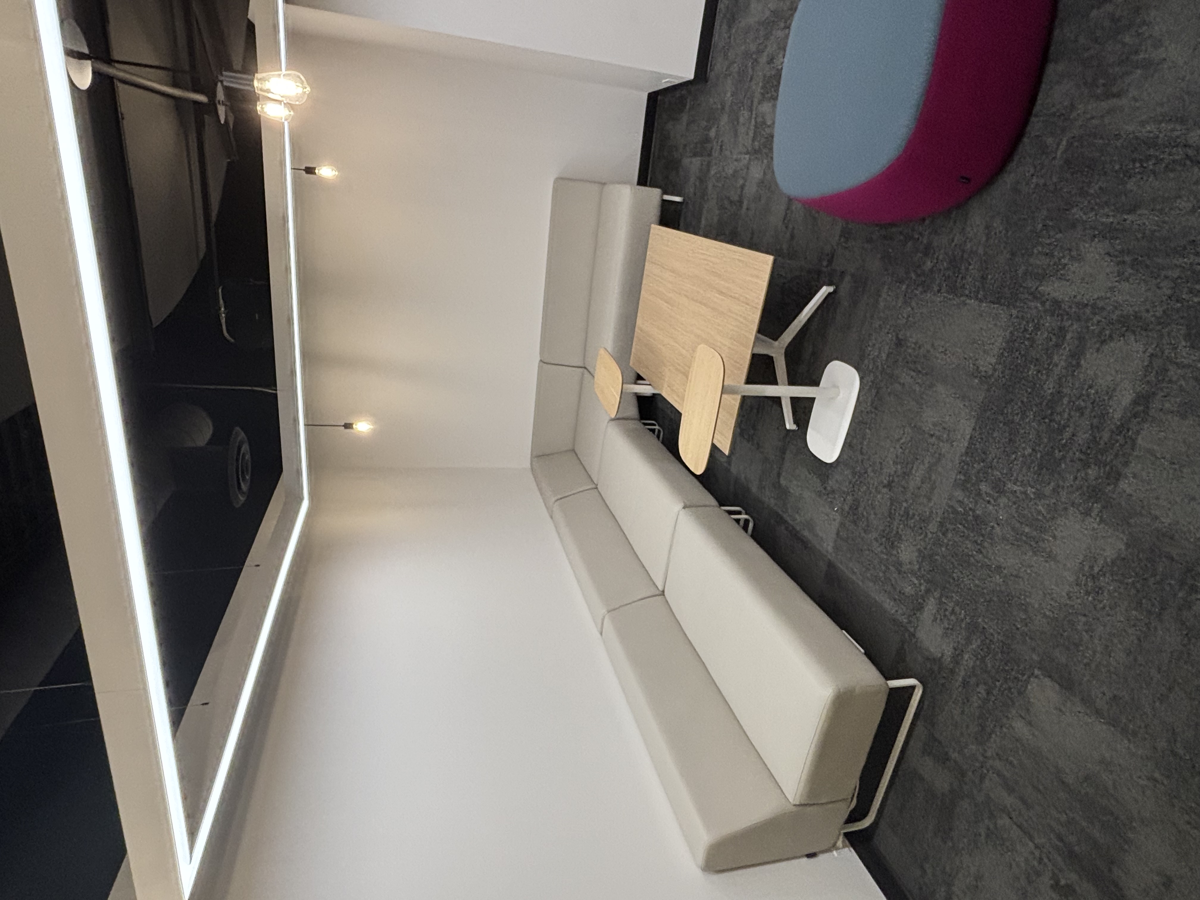 The scene depicted in the photograph is located in the innermost corner of the second floor interior within the SSU building at Sheridan School. This is an open study and discussion area accommodating multiple people.